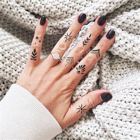 female finger tattoos